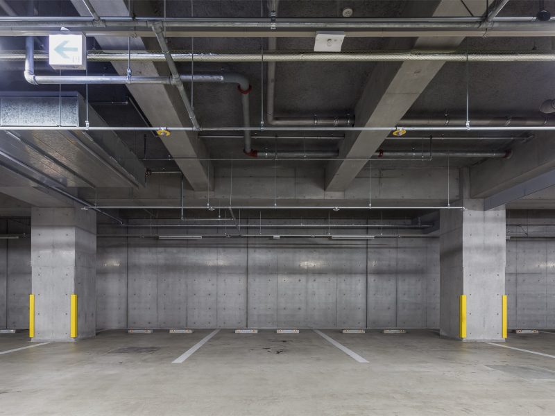 Parking,Garage,Underground,Interior,With,Neon,Lights,Empty,Parking,Lot